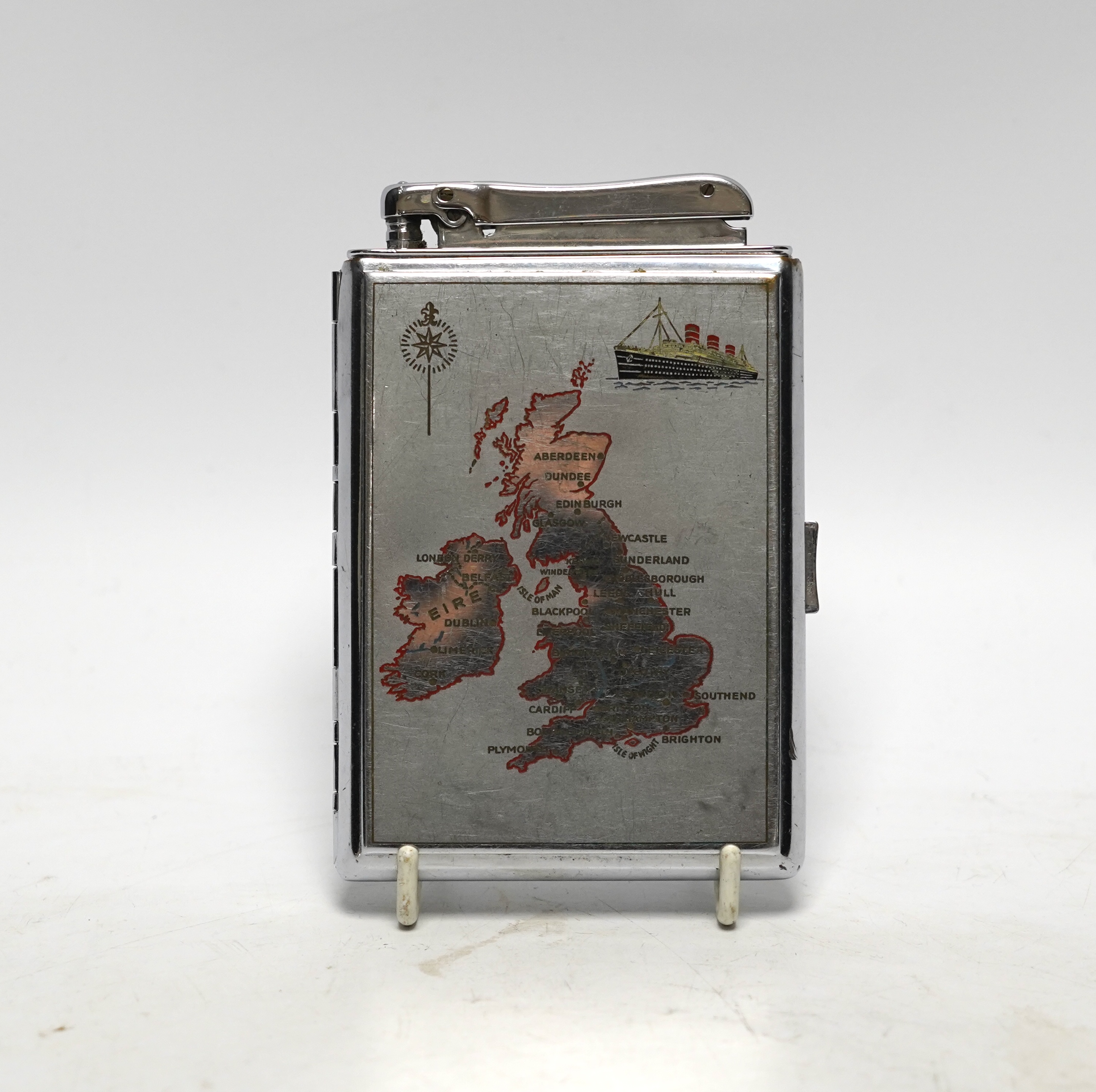 A large chrome Calibri chrome lighter and combination cigarette case with a map of the UK and a ship on the front, 12cm high